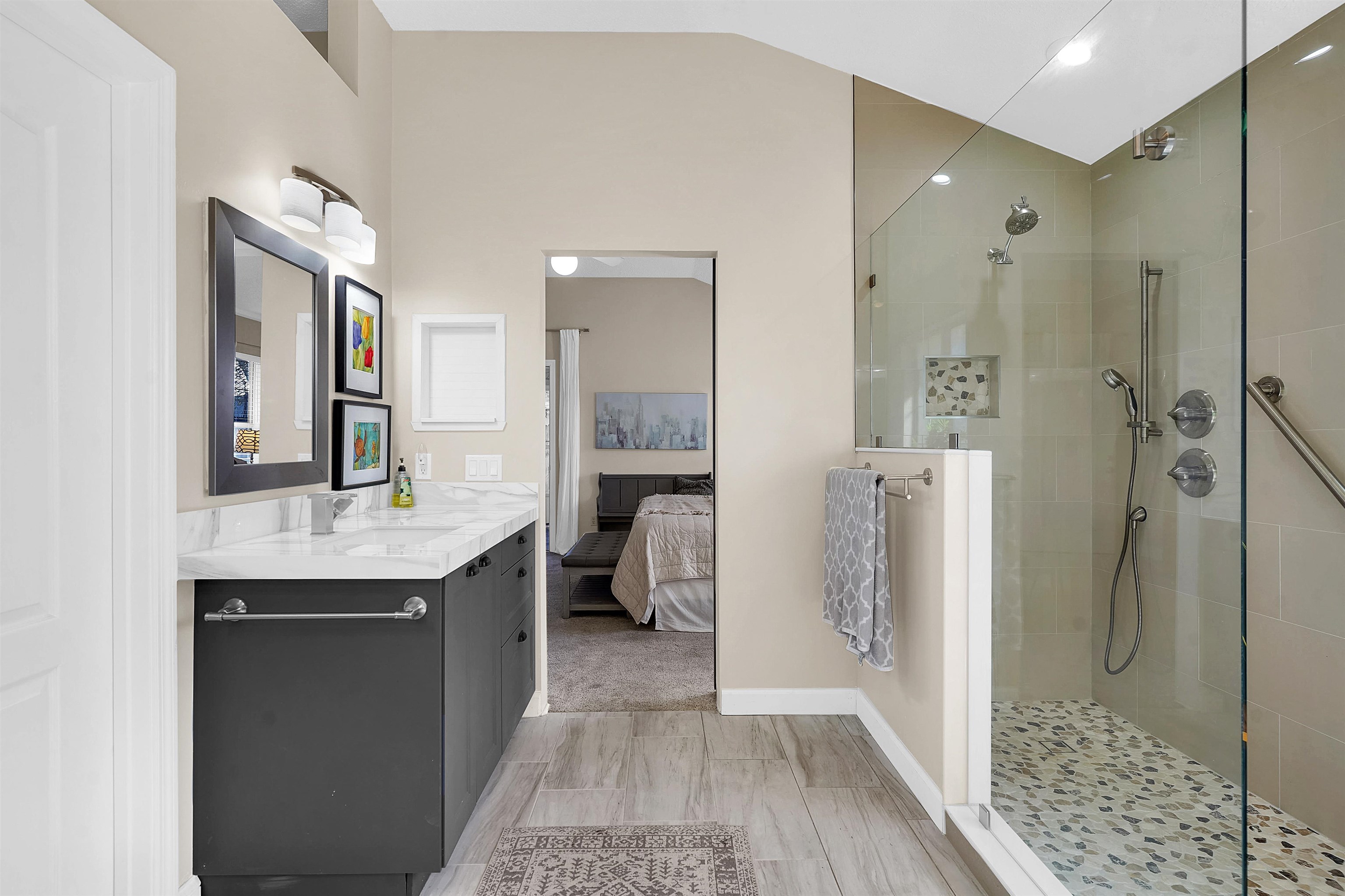 321 Mystical Way St. Augustine, FL 32080 - Photo 24 of 46 Bathroom with ensuite bath, vanity, and a walk in shower