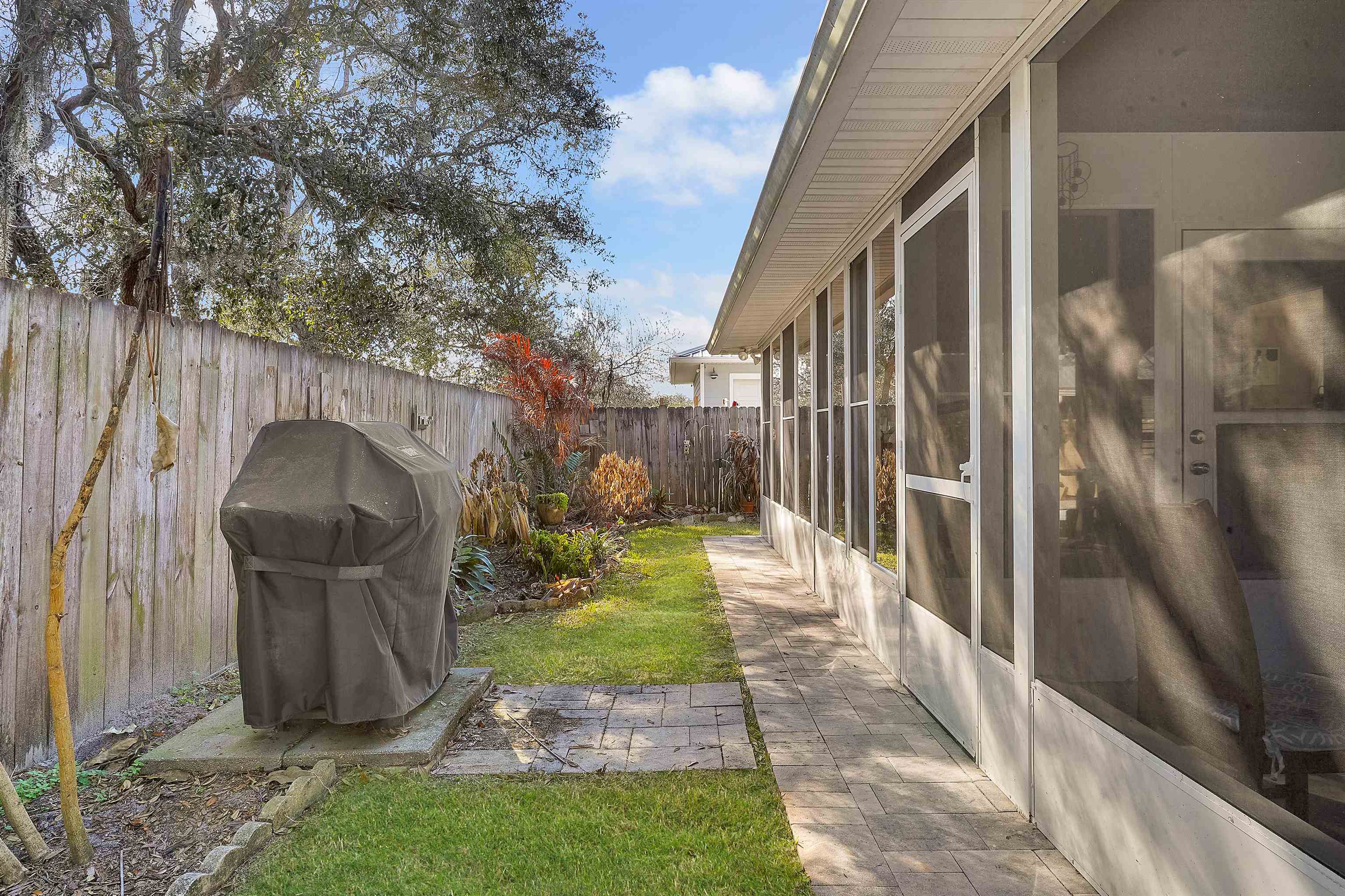 321 Mystical Way St. Augustine, FL 32080 - Photo 28 of 46 Fenced backyard with a sunroom