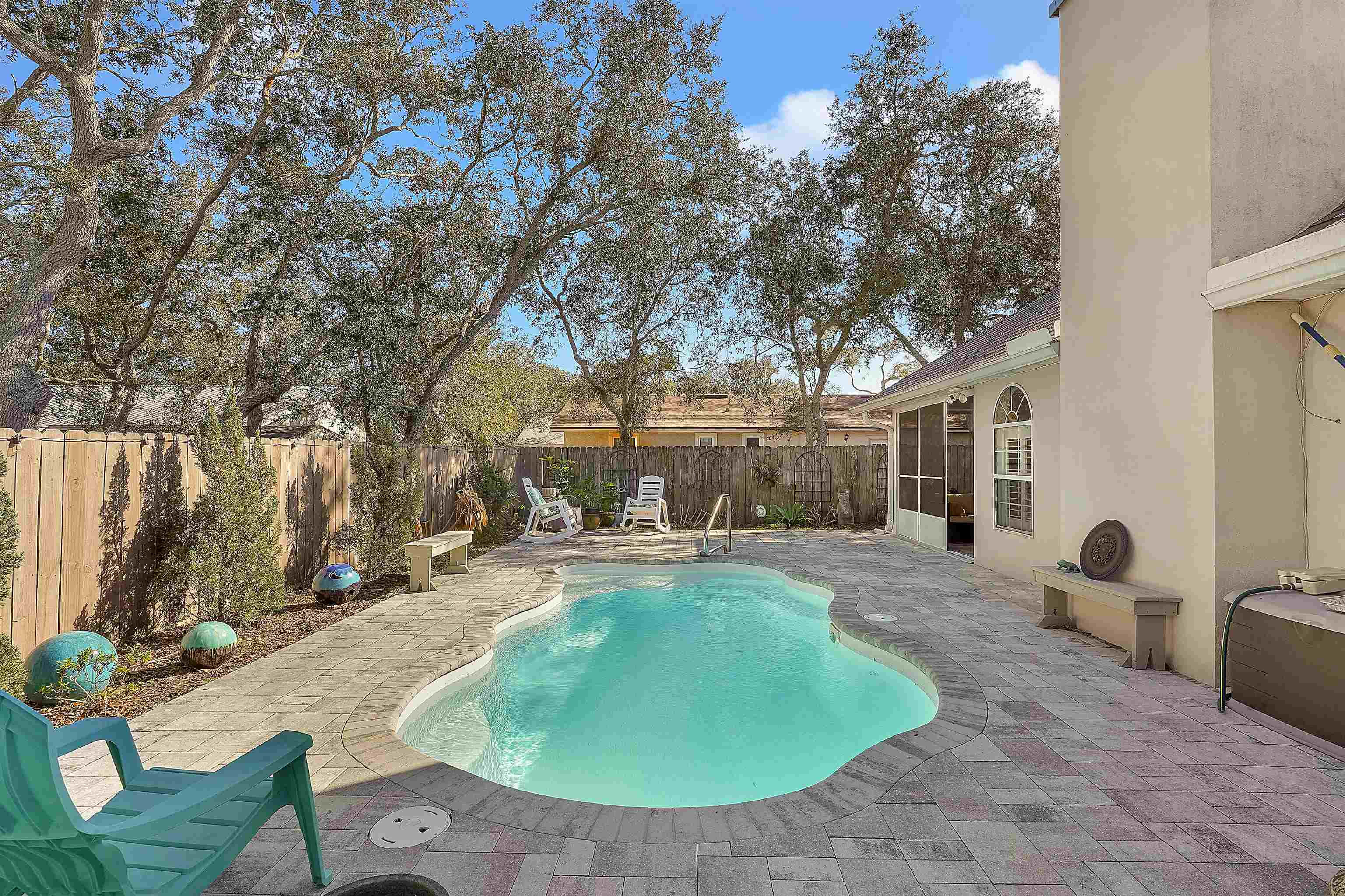 321 Mystical Way St. Augustine, FL 32080 - Photo 30 of 46 View of pool featuring patio surround, a fenced backyard, and a sunroom
