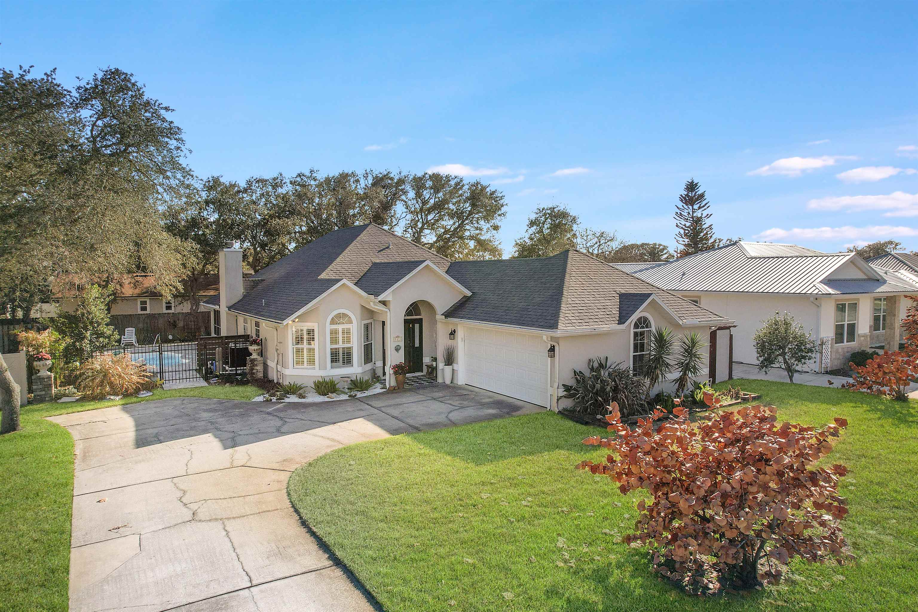 321 Mystical Way St. Augustine, FL 32080 - Photo 34 of 46 Single story home featuring concrete driveway, a garage, stucco siding, and a shingled roof