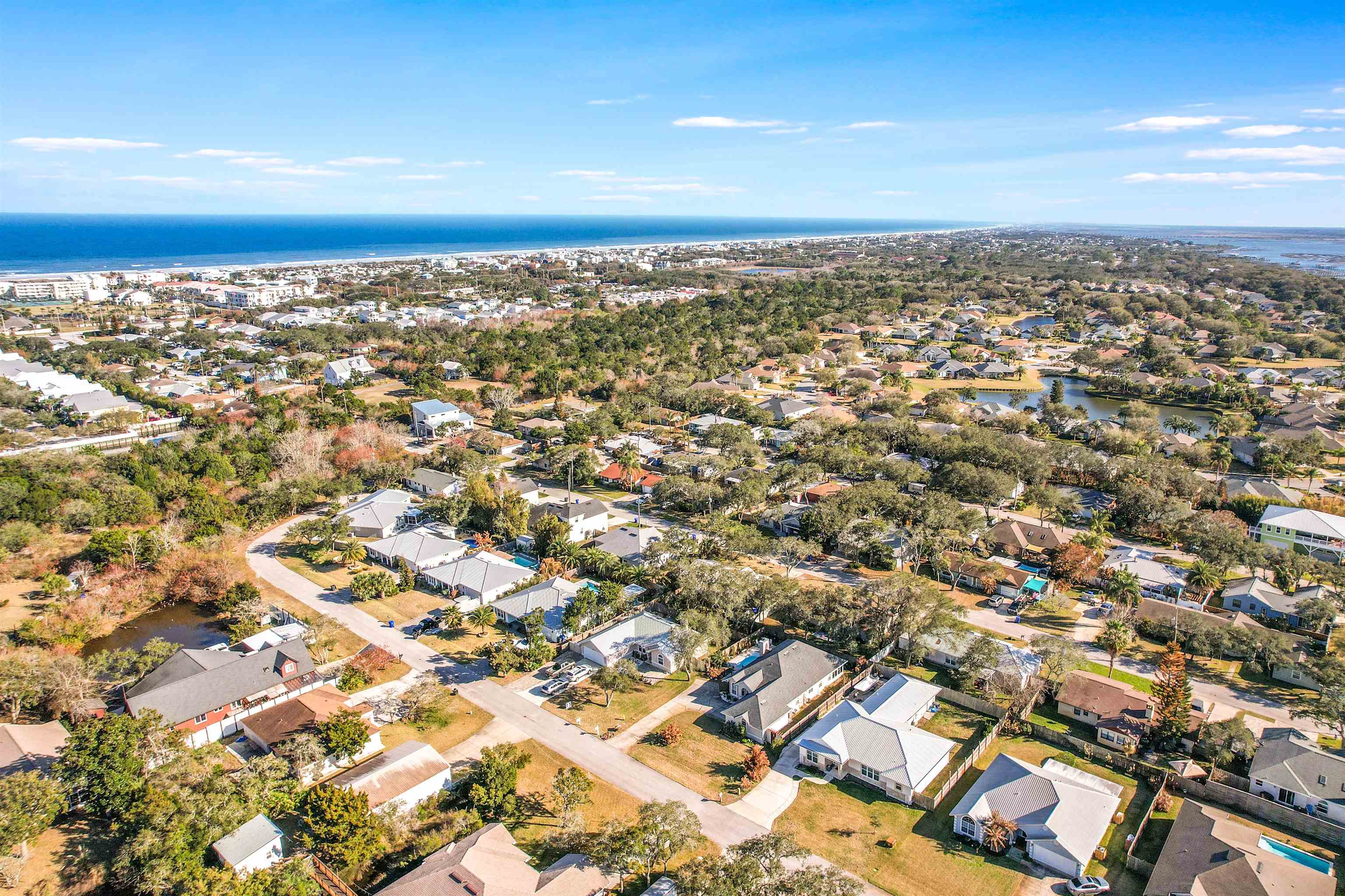 321 Mystical Way St. Augustine, FL 32080 - Photo 36 of 46 Aerial perspective of suburban area with a nearby body of water