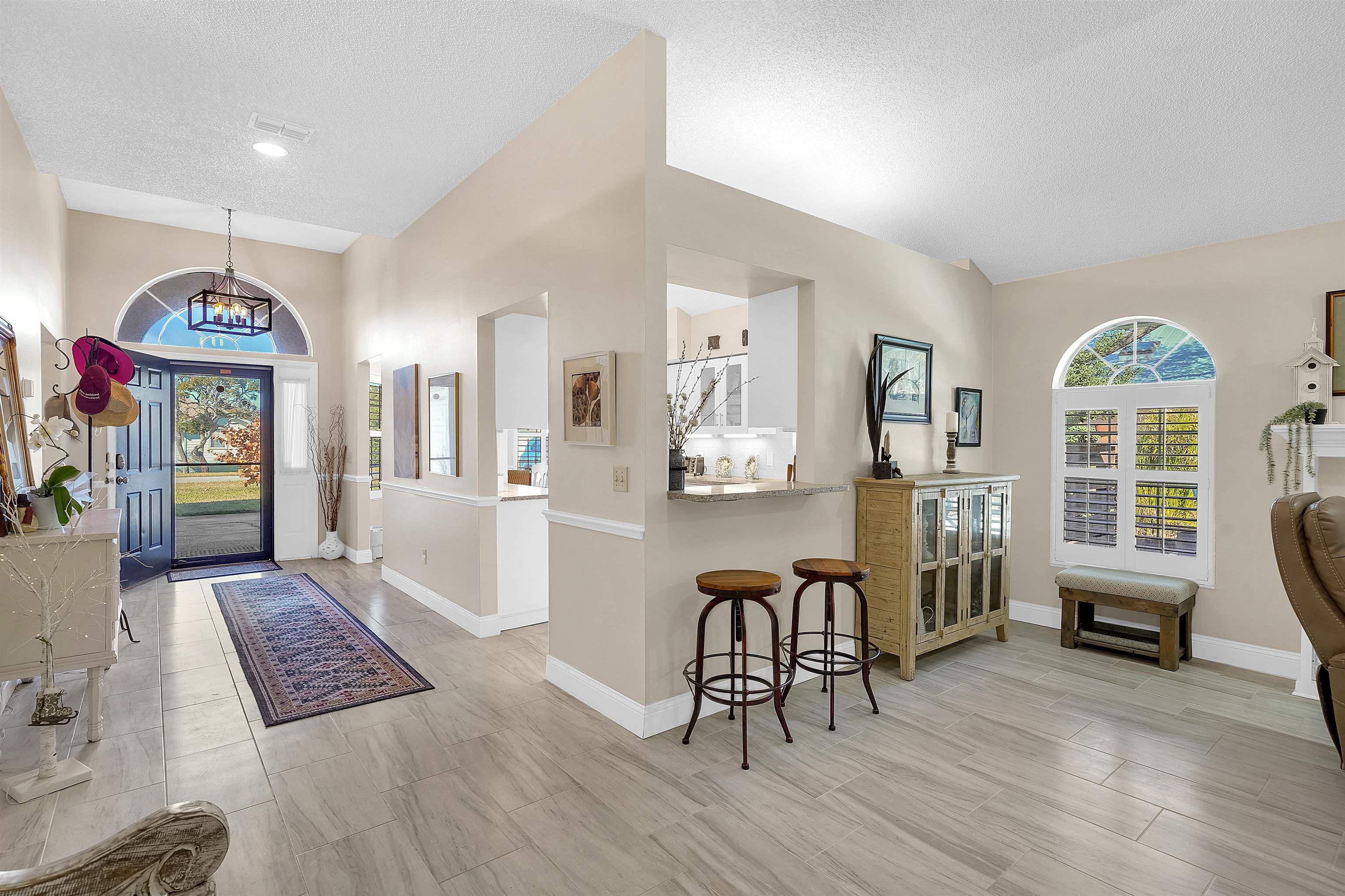 321 Mystical Way St. Augustine, FL 32080 - Photo 8 of 46 Entrance foyer featuring a textured ceiling and a chandelier