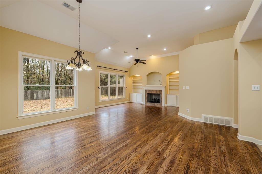 5380 Scarlet Ridge Drive Arlington, TN 38002 - Photo 10 of 35 Spacious living area featuring rich wood-finish flooring, a vaulted ceiling, and recessed lighting