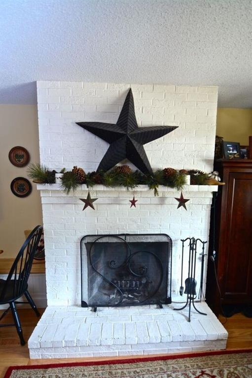 273 Skiway Road, Unit 3G Newry, ME 04261 - Photo 6 of 23 Wood burning fireplace located in...
