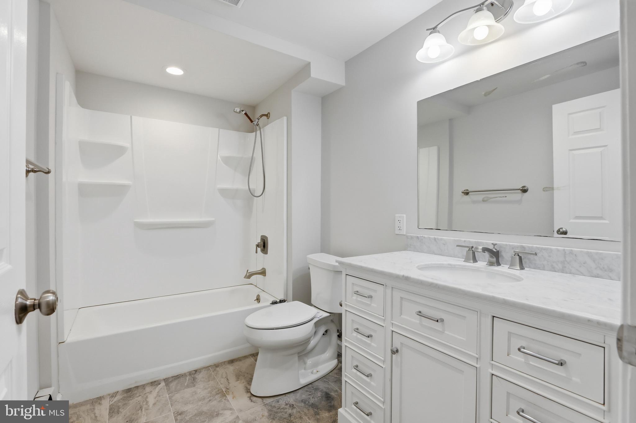 26410 Haines Road Clarksburg, MD 20871 - Photo 25 of 33 a bathroom with a sink a toilet and shower