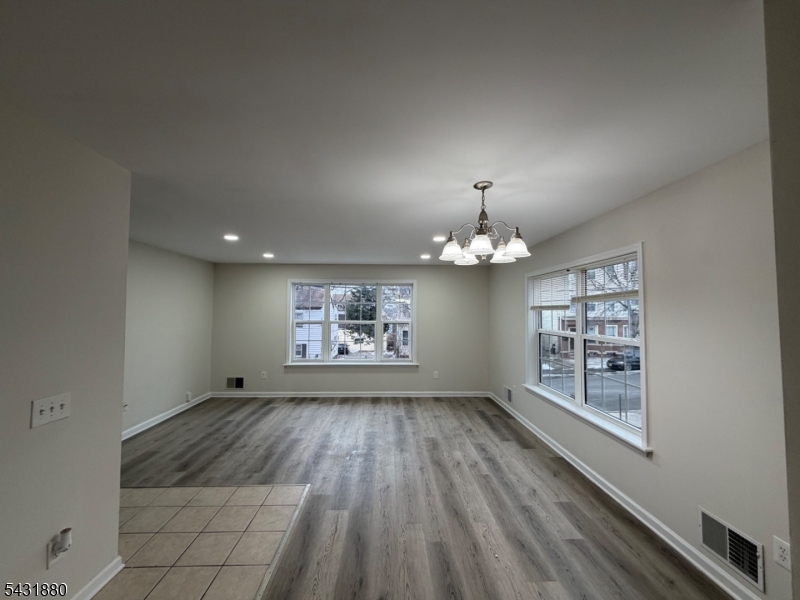 167 North 5th Street, Unit 2 Paterson, NJ 07522 - Photo 2 of 8 wooden floor in an empty room with a window