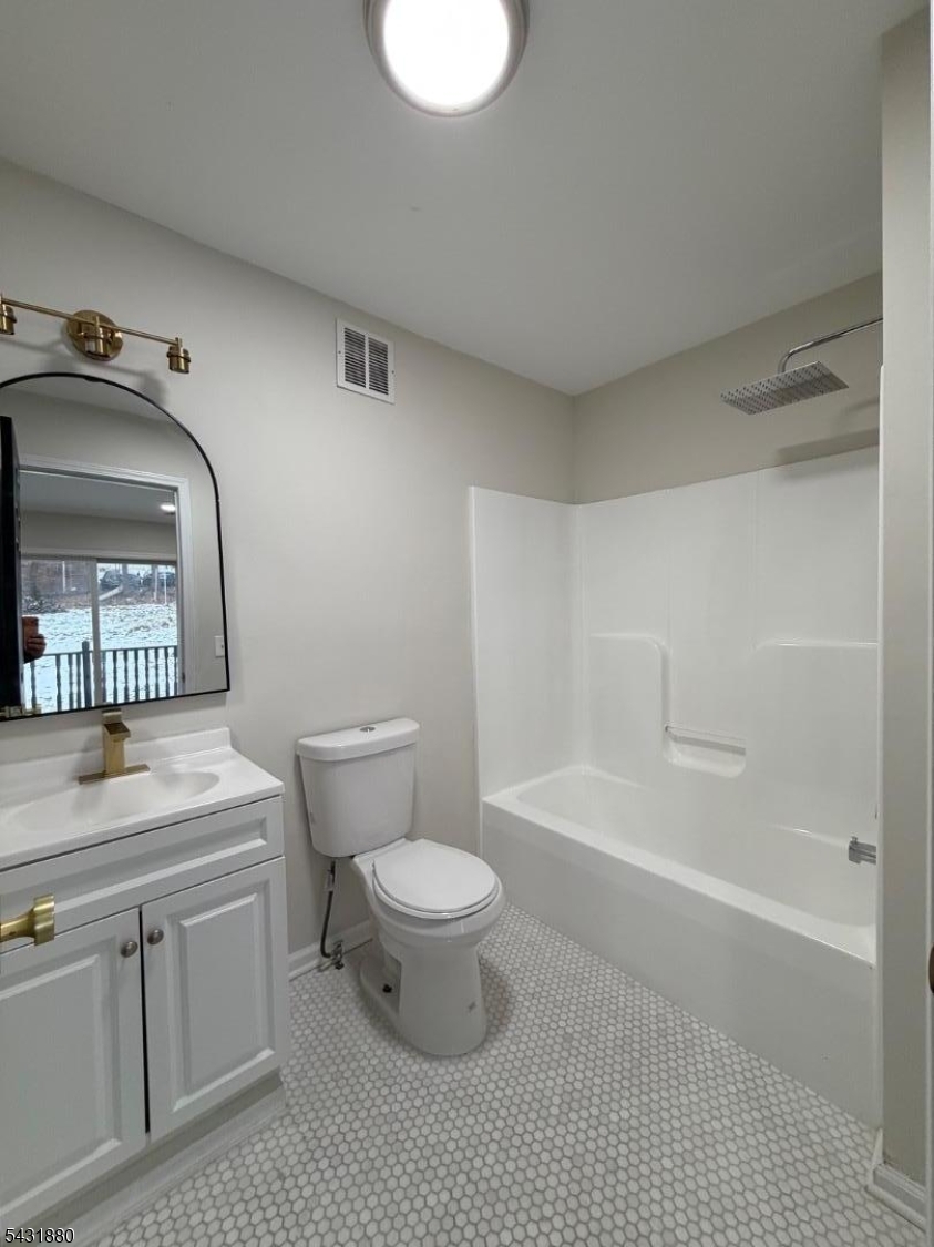 167 North 5th Street, Unit 2 Paterson, NJ 07522 - Photo 7 of 8 a bathroom with a sink a toilet and shower