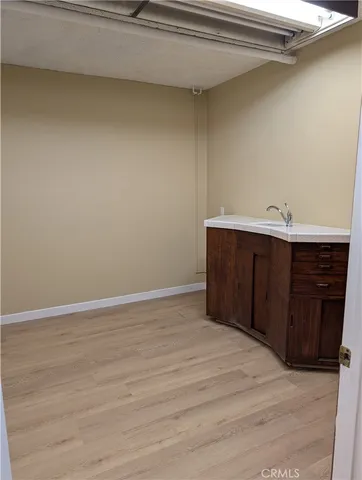 a view of kitchen and wooden floor