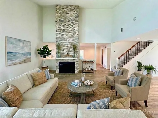 a living room with furniture and a fireplace