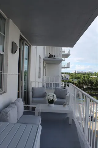 a view of a balcony with chairs