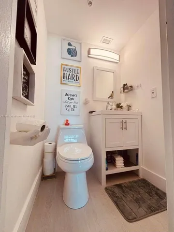 a bathroom with a toilet a sink and a bathtub