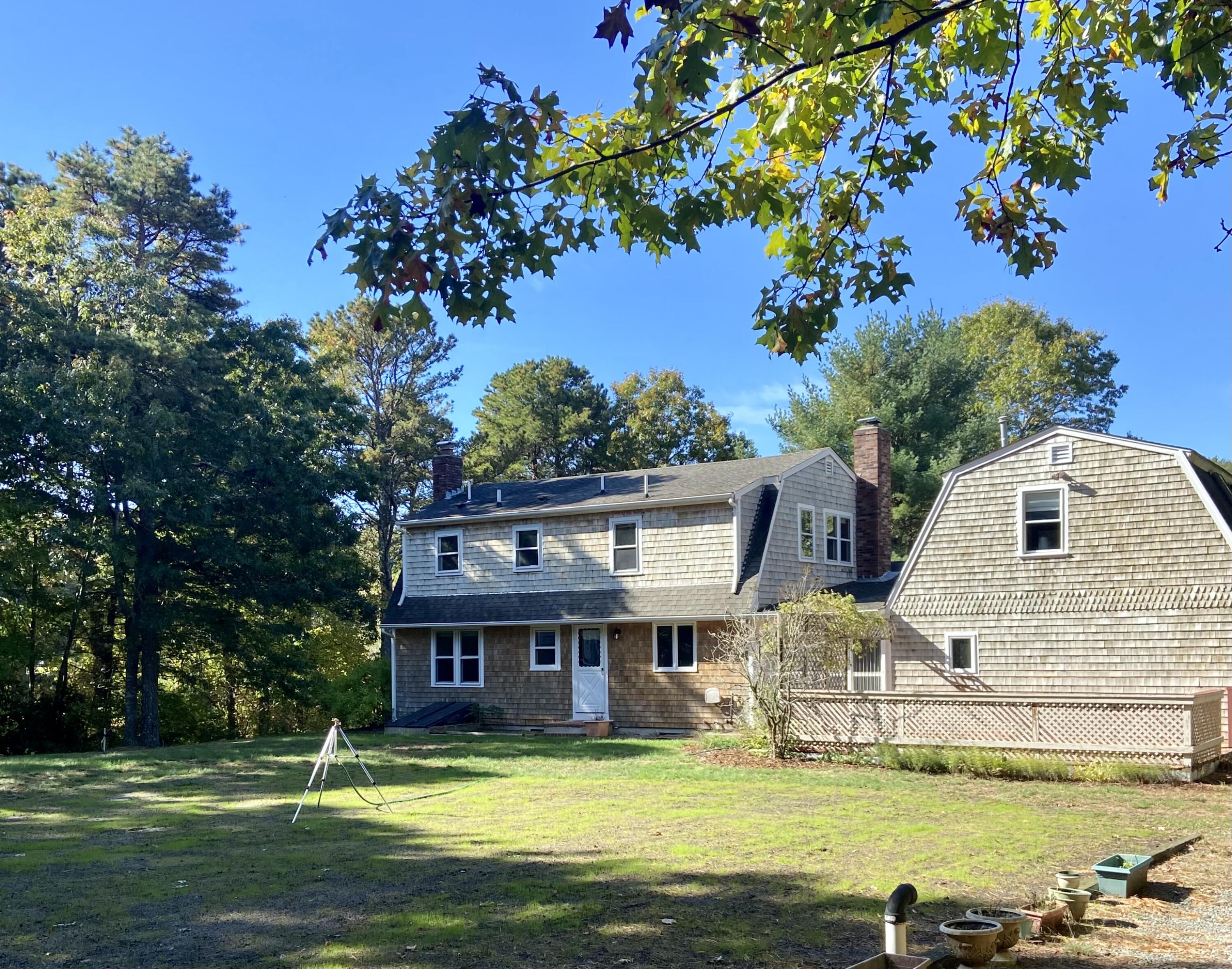 501 County Road Pocasset, MA 02559 - Photo 2 of 33 a view of a house with a big yard and large trees
