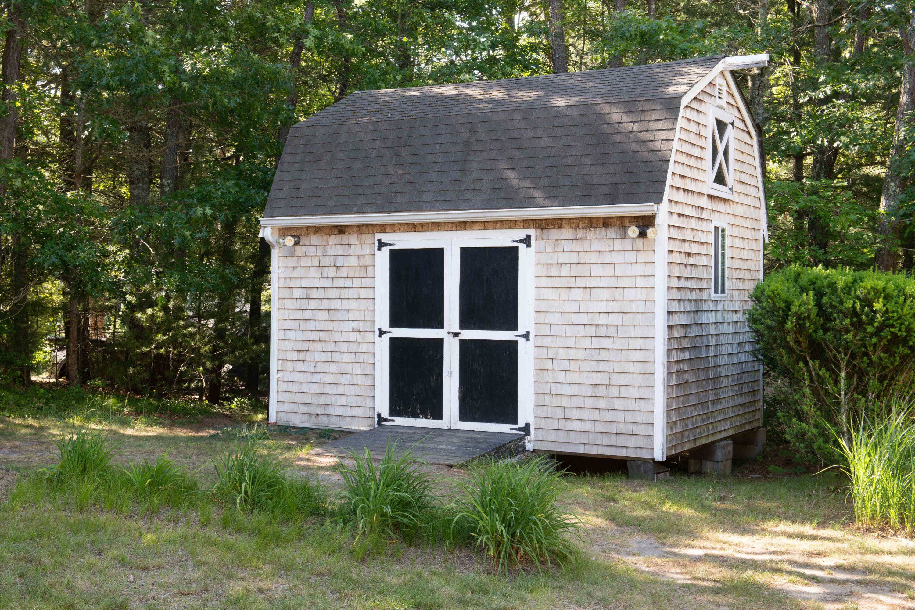 501 County Road Pocasset, MA 02559 - Photo 3 of 33 a aerial view of a house with a garden and trees
