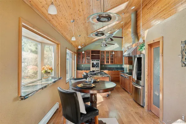 a view of a dining room with furniture window and outside view