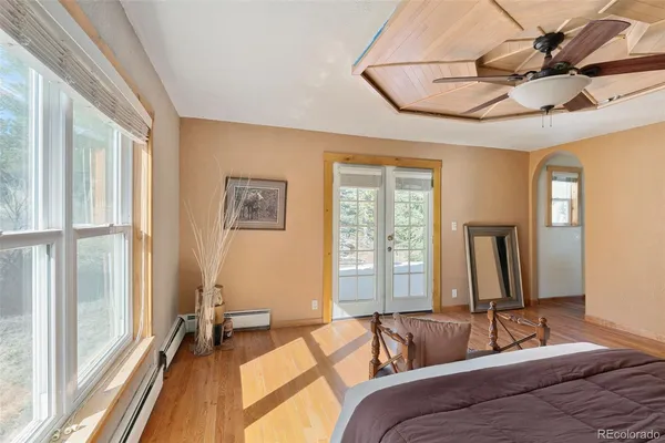 a bedroom with double bed and a window