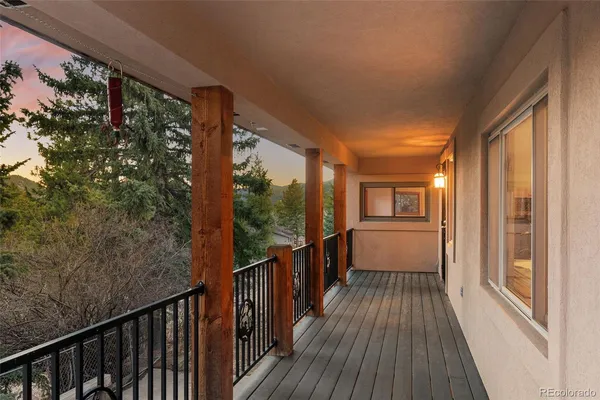 a view of a house with wooden fence