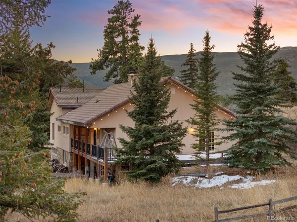 a view of a town with mountains in the background