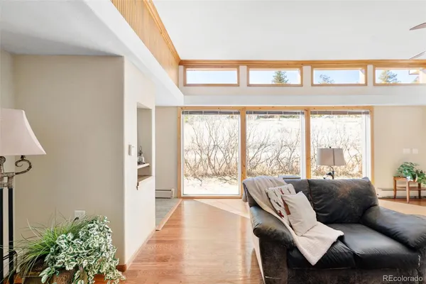 a living room with furniture and a large window