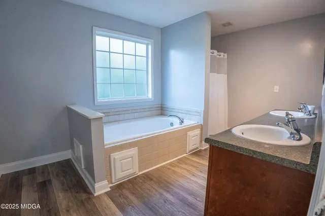 a bathroom with a sink and a bathtub
