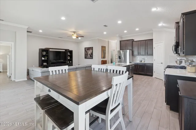 a bathroom with a sink a toilet and shower curtain
