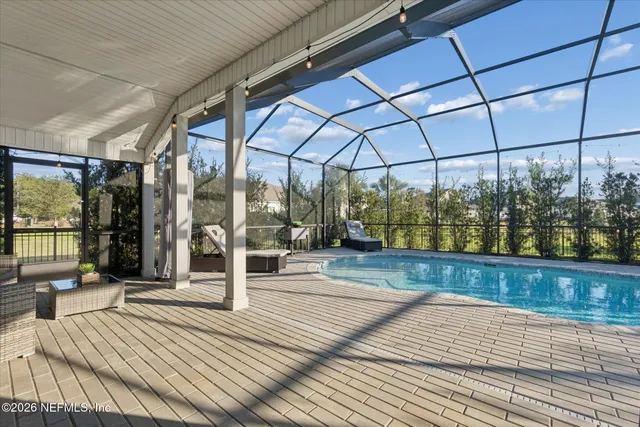 a view of a backyard with sitting area