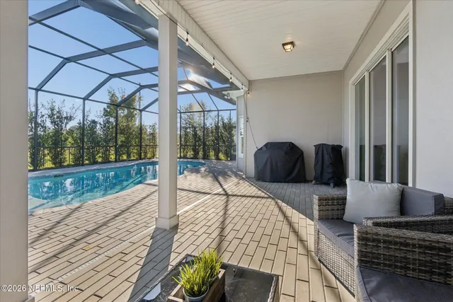 a view of a swimming pool with a patio