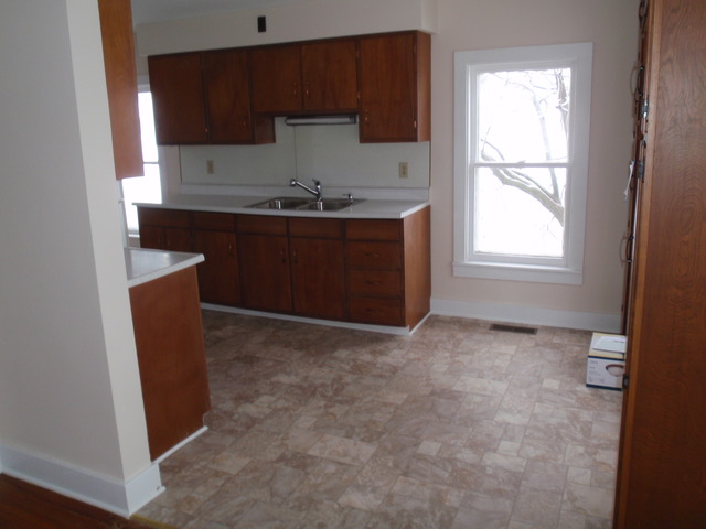 1838 Old State Road Esmond, IL 60129 - Photo 12 of 21 a kitchen with a sink a window and cabinets