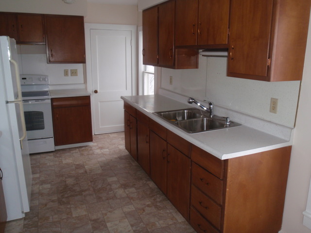 1838 Old State Road Esmond, IL 60129 - Photo 13 of 21 a kitchen with stainless steel appliances a sink stove and cabinets