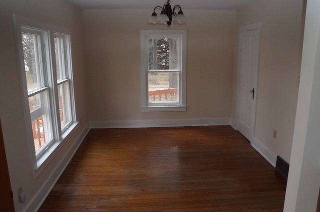 1838 Old State Road Esmond, IL 60129 - Photo 20 of 21 a view of an empty room with wooden floor and a window
