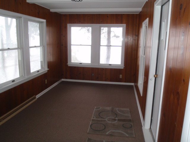 1838 Old State Road Esmond, IL 60129 - Photo 8 of 21 a view of an empty room with wooden floor and a window