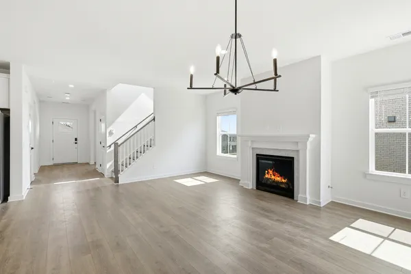 a view of a room with wooden floor and windows