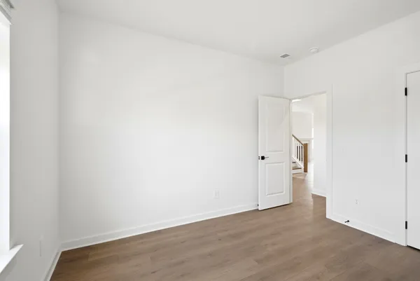 an empty room with wooden floor