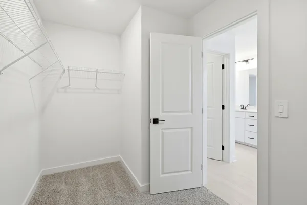 a bathroom with a double vanity sink and mirror