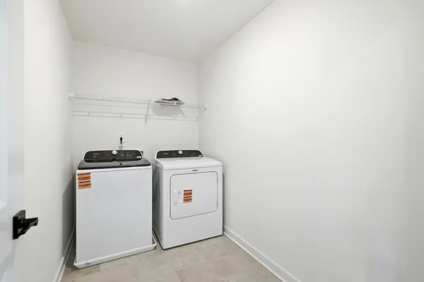 a view of a hallway with white walls
