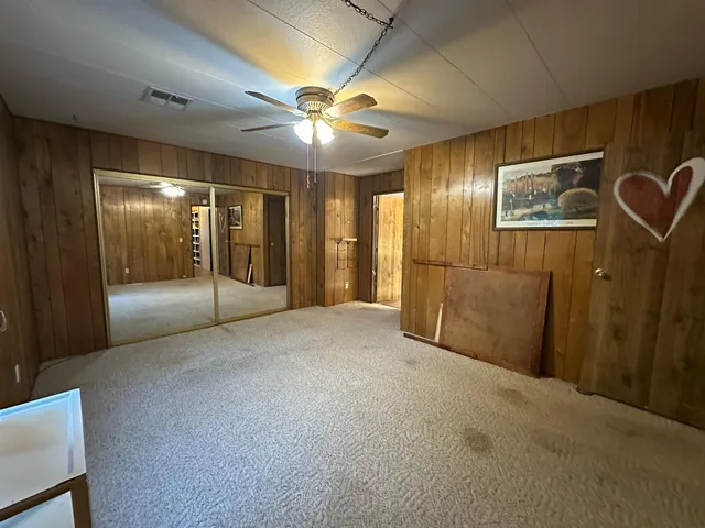 a view of empty room with window and fireplace