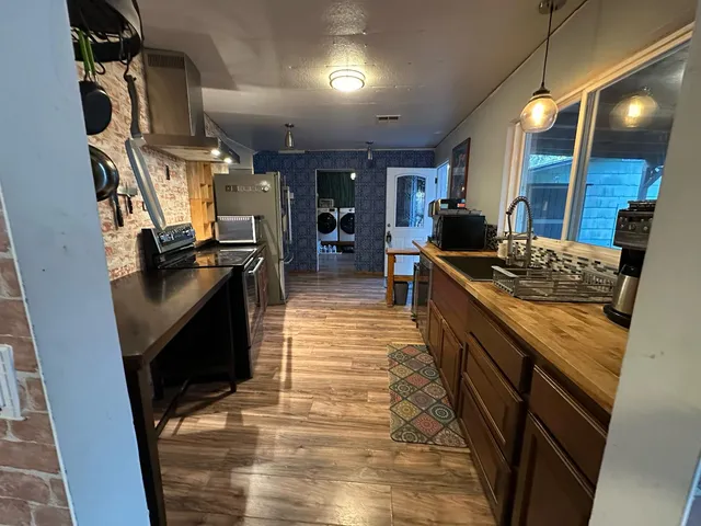 a kitchen with granite countertop lots of counter top space