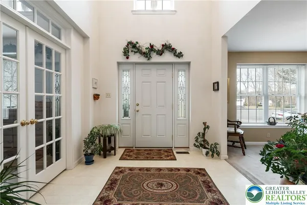 a living room with furniture and flowers