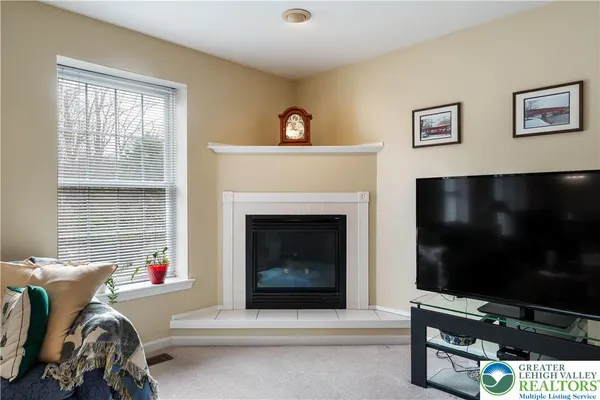 a kitchen with stainless steel appliances a refrigerator and microwave