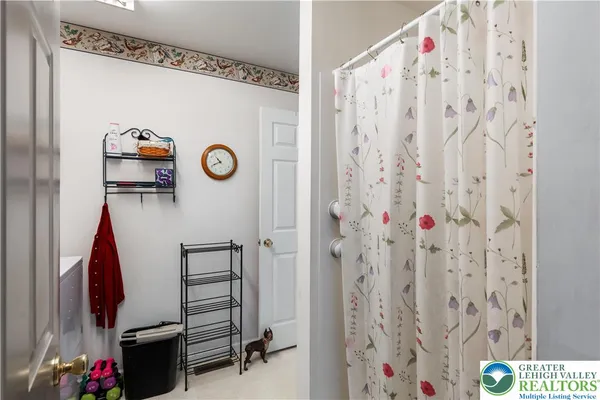 a view of bedroom with furniture and staircase