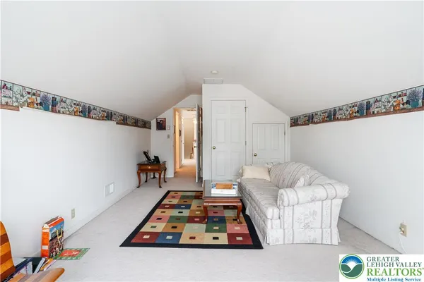 a bedroom with bed and window