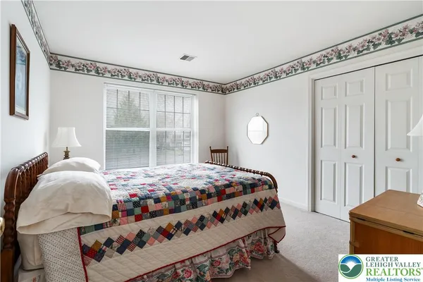 a room that has a bed and a closet