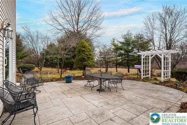 a view of a patio with couple of chairs