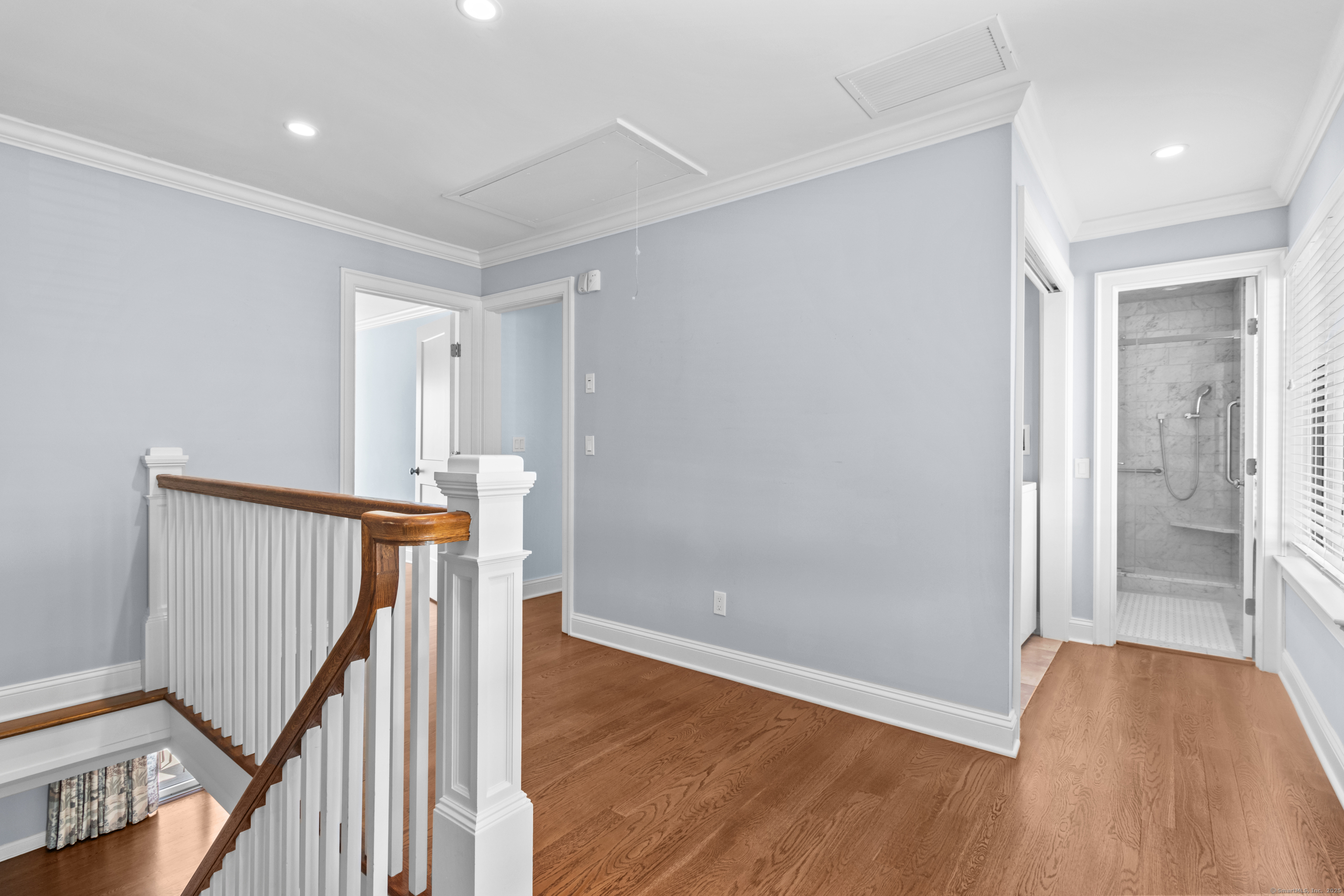 199 Gregory Boulevard, Unit D2 Norwalk, CT 06855 - Photo 13 of 31 a view of a hallway with wooden floor and stairs