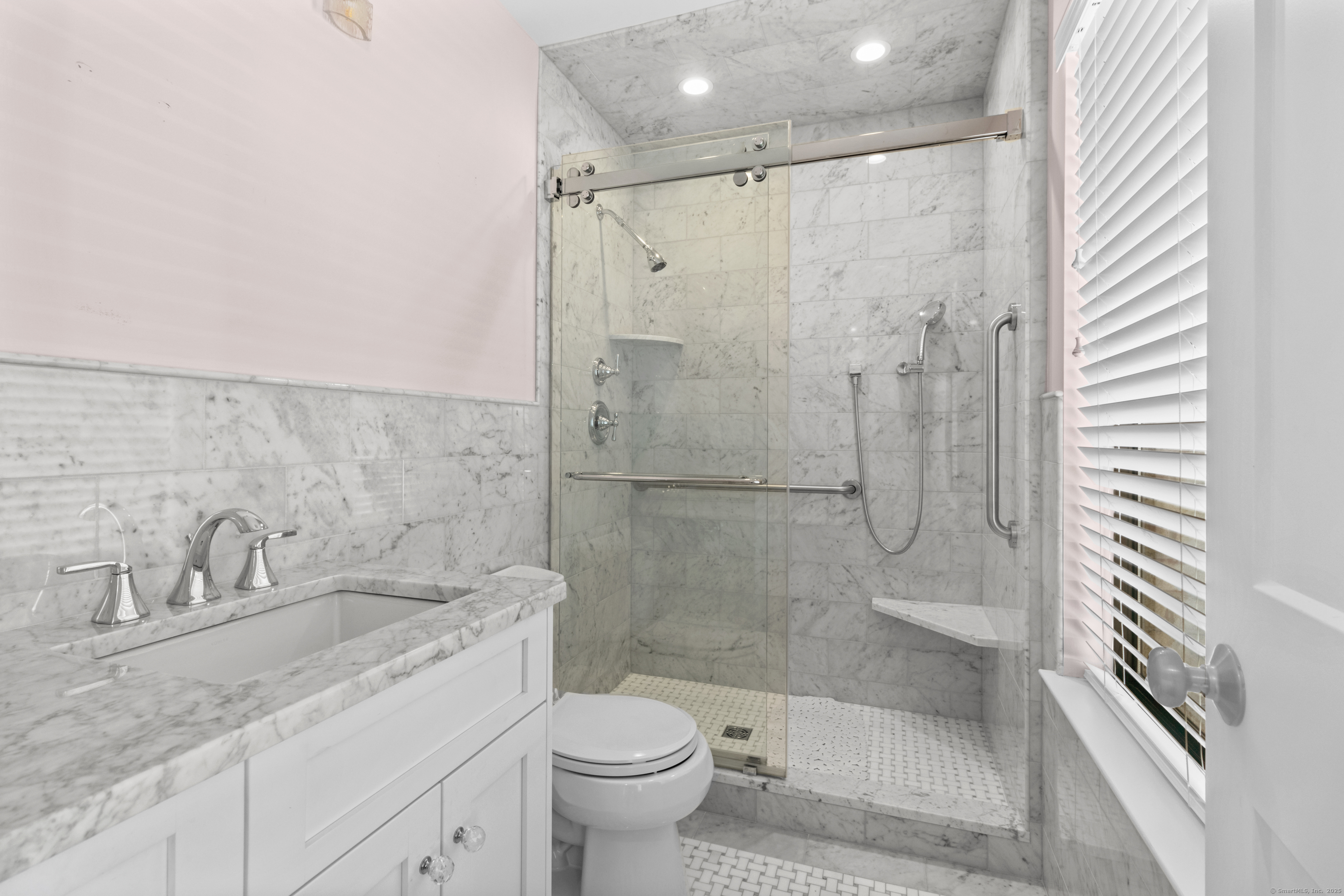 199 Gregory Boulevard, Unit D2 Norwalk, CT 06855 - Photo 24 of 31 a bathroom with a sink toilet and shower