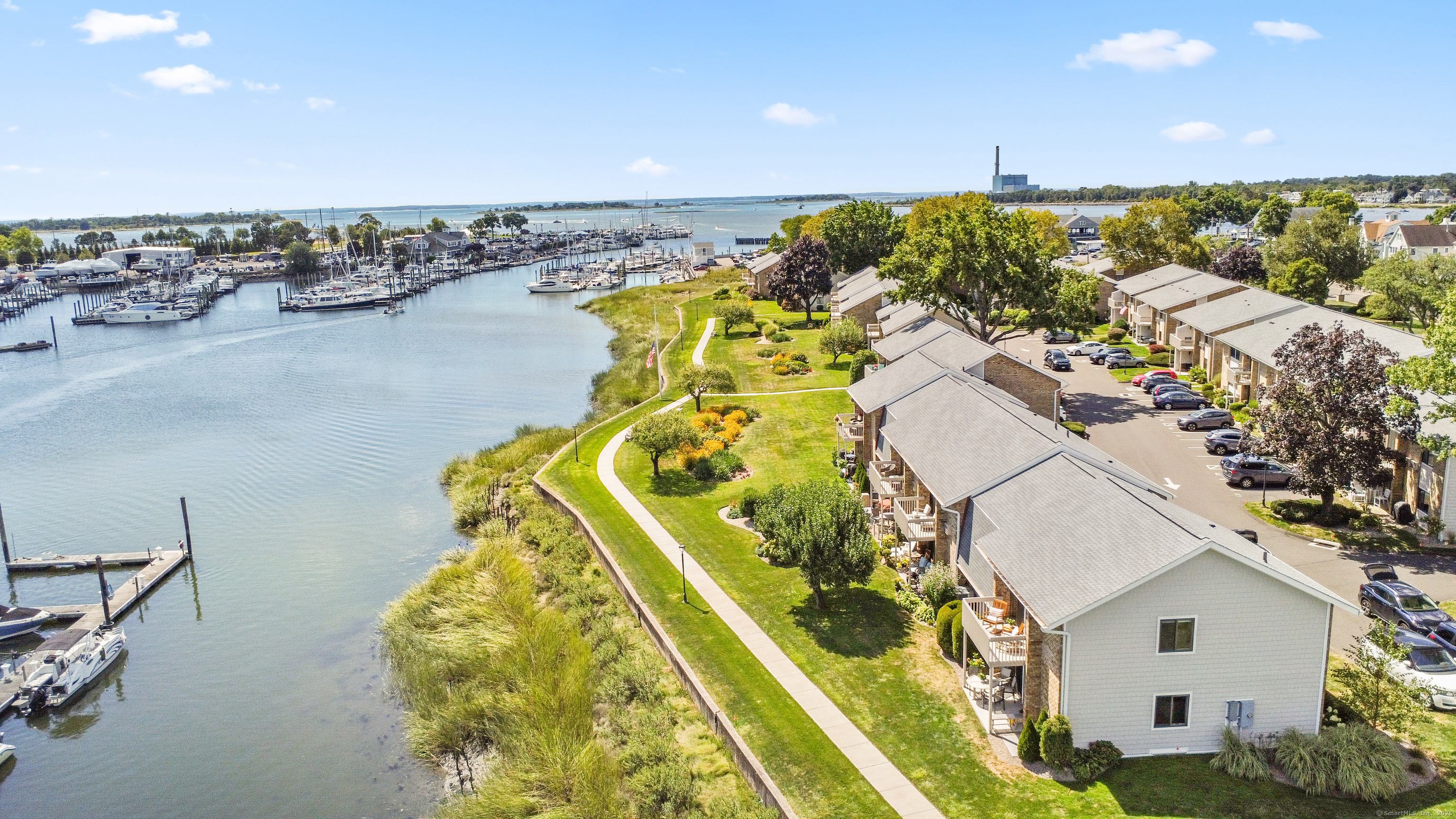 199 Gregory Boulevard, Unit D2 Norwalk, CT 06855 - Photo 27 of 31 a view of a swimming pool with a table and chairs