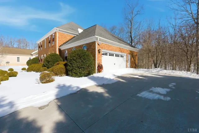 a view of a house with a snow in the yard