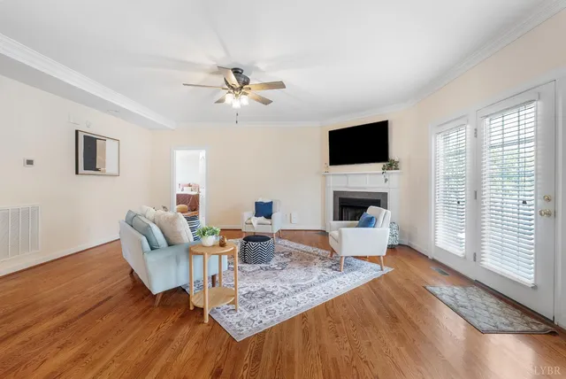 a living room with furniture fireplace and a flat screen tv