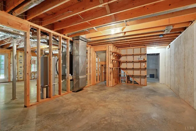 a bathroom with a granite countertop sink a mirror and wooden cabinets