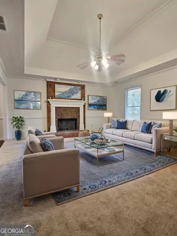 a living room with furniture and a fireplace