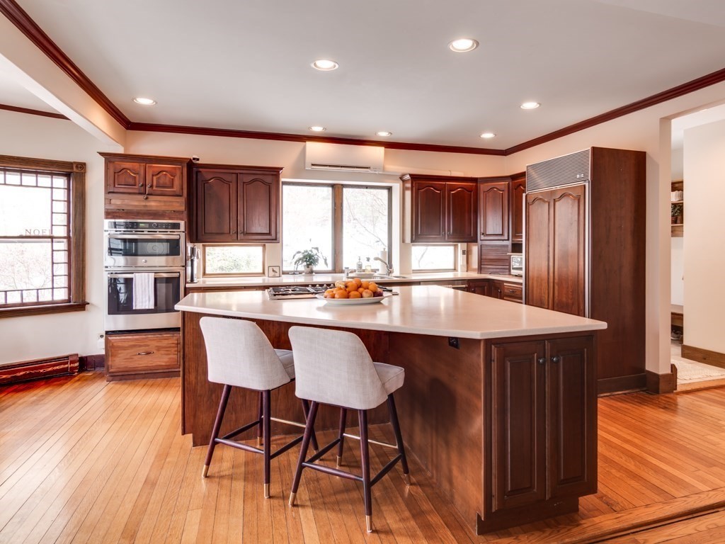 7 Emily Lane Gloucester, MA 01930 - Photo 12 of 41 a kitchen with a table chairs refrigerator and cabinets